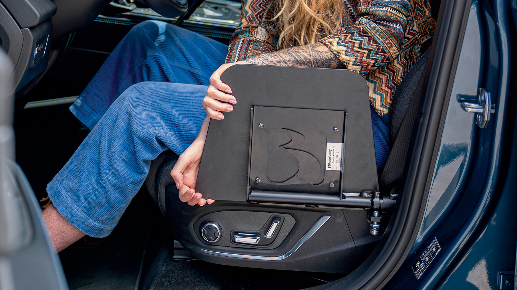 A car seat wit adaptations for wheelchair users